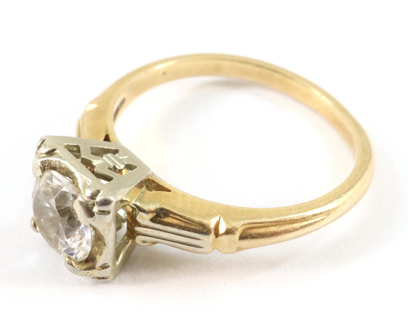14/18k Diamond Solitaire Ring: A vintage 14k/18k two tone Gold and Diamond solitaire engagement ring. Approx. 1/2 carat. Size 5. 2.4 grams total weight. Some wear. ESTIMATE $400-600
