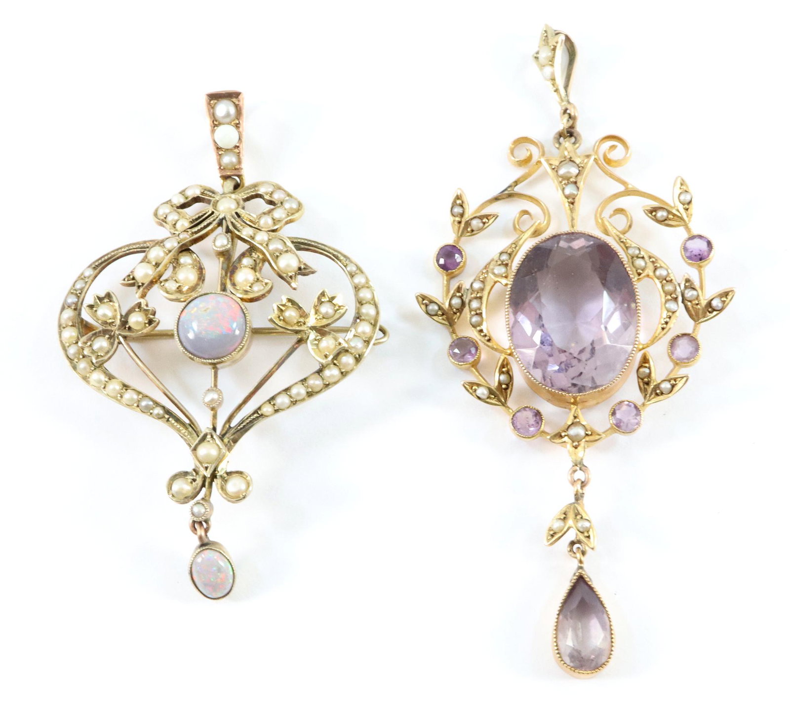 2 9k Gold Edwardian Pendants: Two 9k Gold Edwardian pendants. One Amethyst and one Opal, both with seed Pearl accents. 15.0 grams total weight. Minor wear. Up to 2 1/4" high. ESTIMATE $200-300