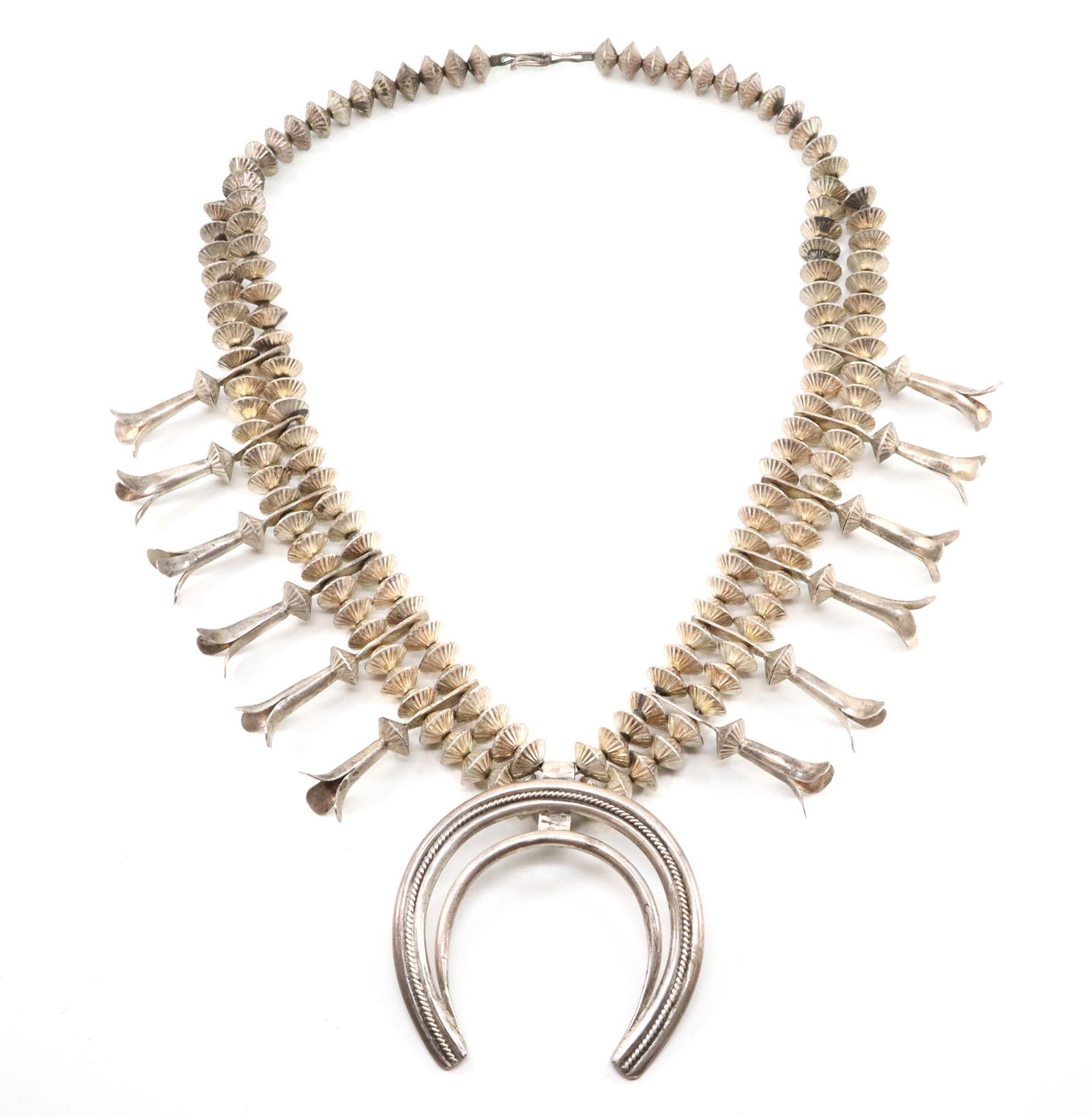 Navajo Squash Blossom Necklace ES: Navajo Silver Squash Blossom necklace by Elaine Sam. Initialed "E S". 205.6 grams total weight. Slight wear. 24 1/2" long. ESTIMATE $600-800