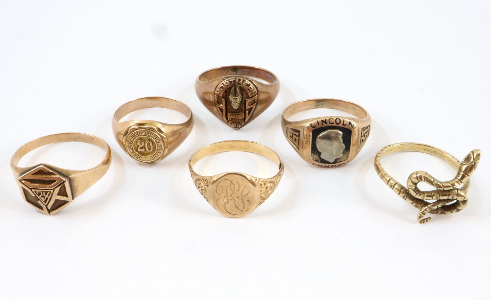 6 10k Gold rings: Six 10k Gold rings including Class and Sorority rings. 24.8 grams total weight. Some quite worn. ESTIMATE $400-600