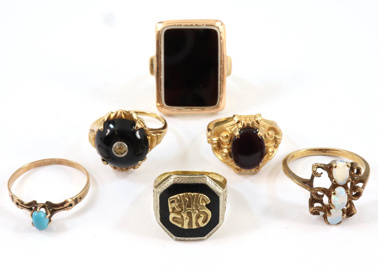 6 10k Gold rings: Six 10k Gold rings including Class, Onyx and Opal rings. 23.0 grams total weight. Some wear. ESTIMATE $200-300