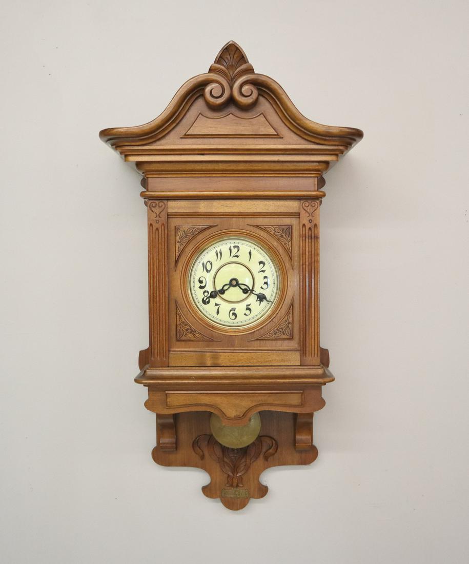 Vienna Wall Clock: A late 19th century Vienna free swinger wall clock, Walnut case with a 8 day spring driven time and strike movement. Minor wear. 39" tall. ESTIMATE $200-400