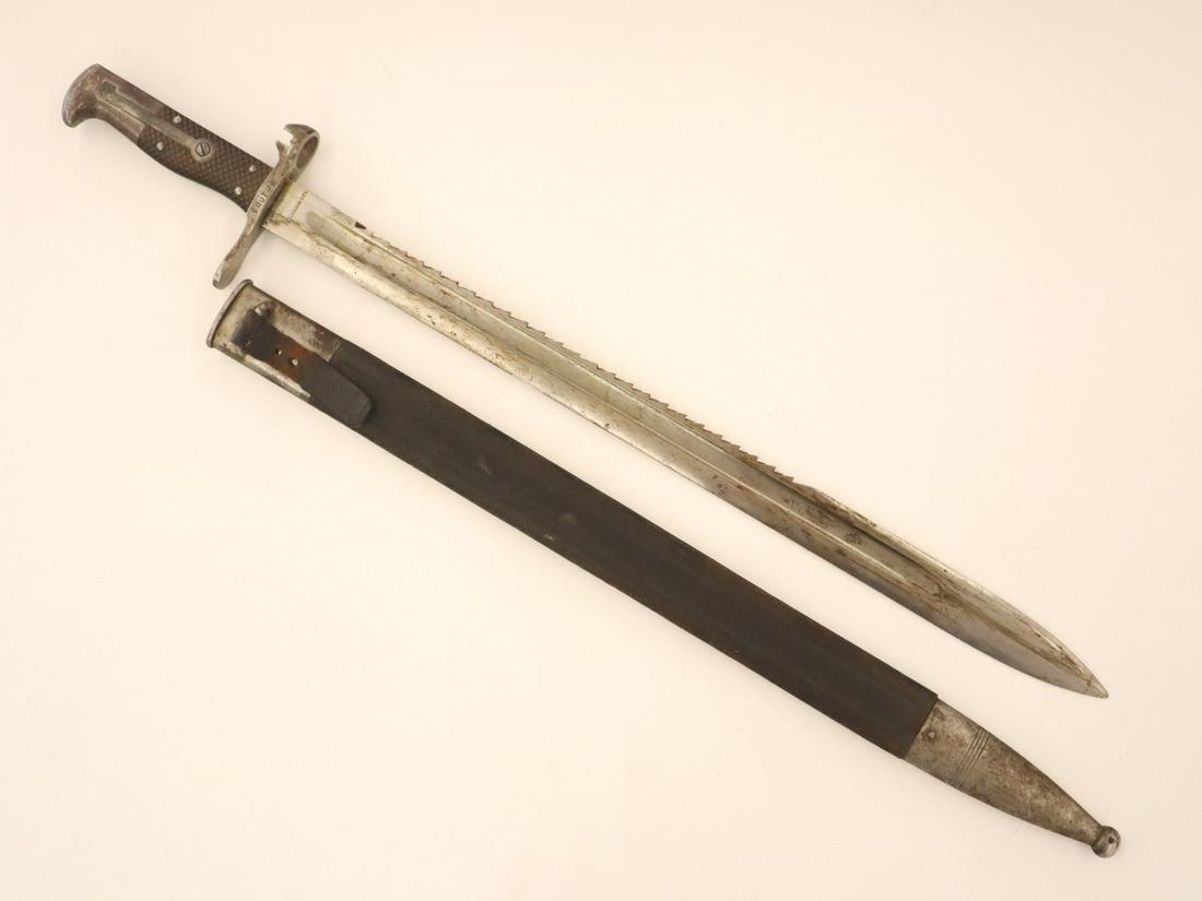 Swiss Model 1878 Sawback Bayonet: A 19th century Swiss Model 1878 sawback bayonet and scabbard, marked "S.J.C. Neuhausen". Serial # 201005. Some surface rust on handle and scabbard, with some wear to leather. 22" overall. ESTIMATE $10
