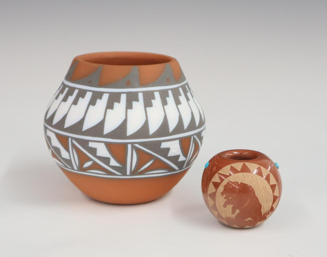 2 Southwest Redware Pottery Jars: Two small late 20th century Southwest redware pottery jars, larger jar with feather band at shoulder signed "Mary Smith"; smaller jar is decorated with a standing bear and walking bear signed "Red Sta