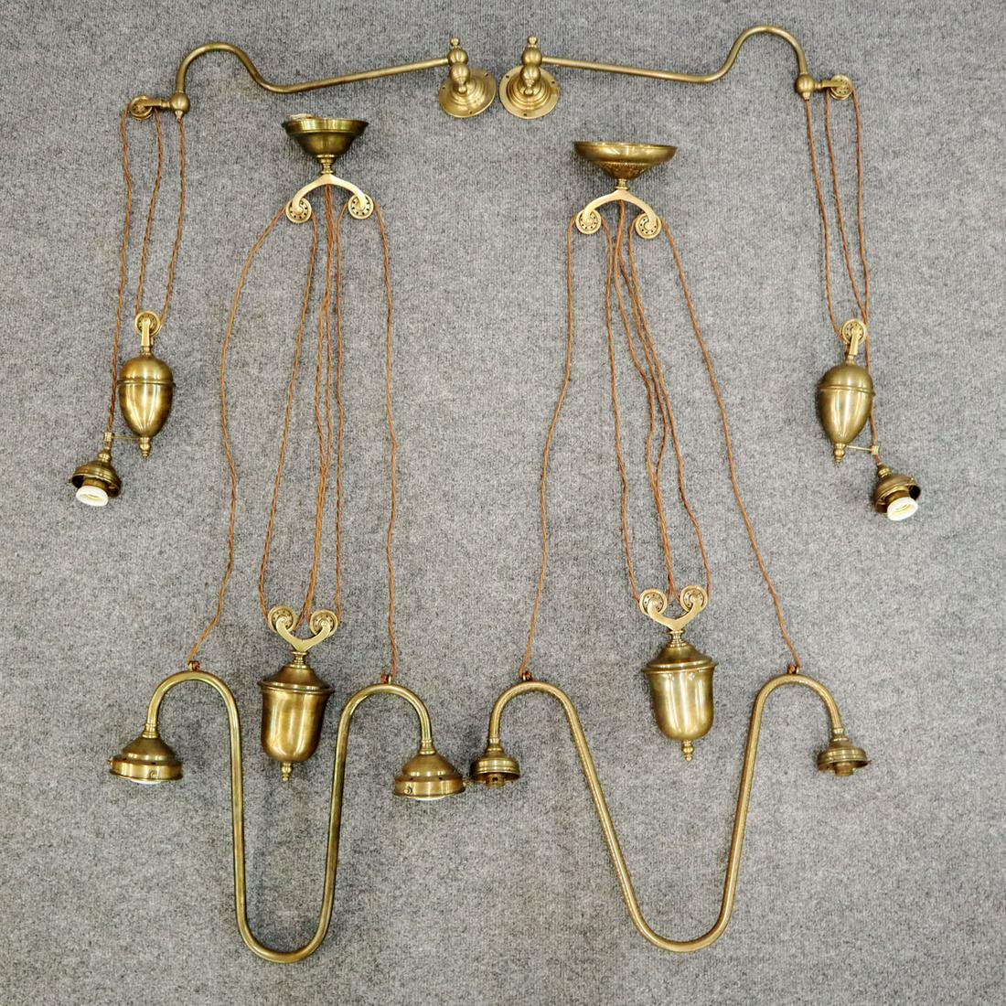 4 Brass Light Fixtures: Four late 20th adjustable light fixtures, includes a pair of wall sconces and two ceiling fixtures. All are adjustable heights with brass counter weights. No shades, minor tarnish. Up to 18" wide. EST