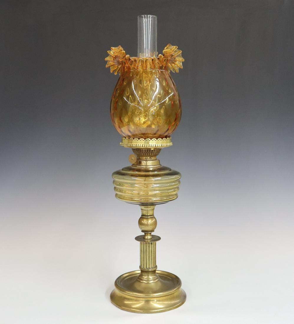 Banquet Lamp: A late 19th century Amber font brass base banquet lamp, burner marked "Brenner & Kosmos". Replaced shade and some wear to the fitter. 22" high. ESTIMATE $100-200