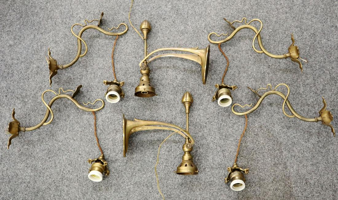 6 Bronze Wall Sconces: Six late 20th century bronze wall sconces. 4 matching sconces with vine and leaf decoration and 2 Art Nouveau style with adjustable sockets. No shades, minor tarnish. Up to 11" long. ESTIMATE $100-200