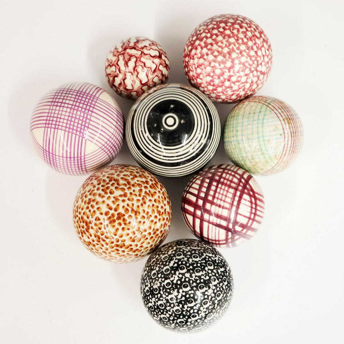 8 19th Century Carpet Balls: Collection of eight 19th century carpet balls, in various patterns and colors. Several have small contact chips, mostly on the smallest ball. 2 1/4 - 3 1/4" diameters. ESTIMATE $100-200