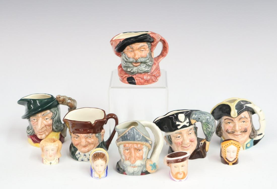 6 Character Jugs and 4 Thimbles: Six late Royal Doulton Character Jugs and four thimbles of Henry the VIII and some of his wives. Minor wear to each figure. Up to 2 3/4" high. ESTIMATE $50-100