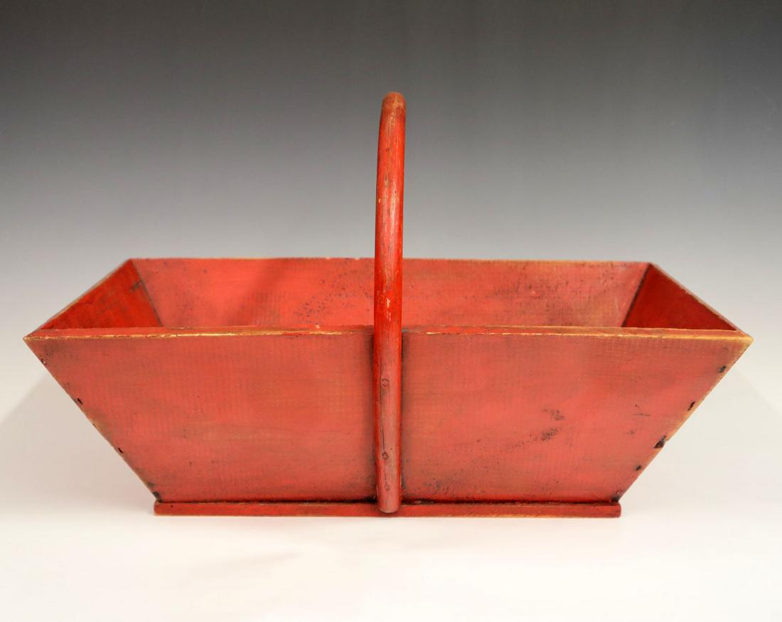 French Wooden Garden Tote: A turn of the century French wooden garden tote with bentwood handle. Original red paint finish, nailed construction. 13 x 19 1/2". ESTIMATE $50-100
