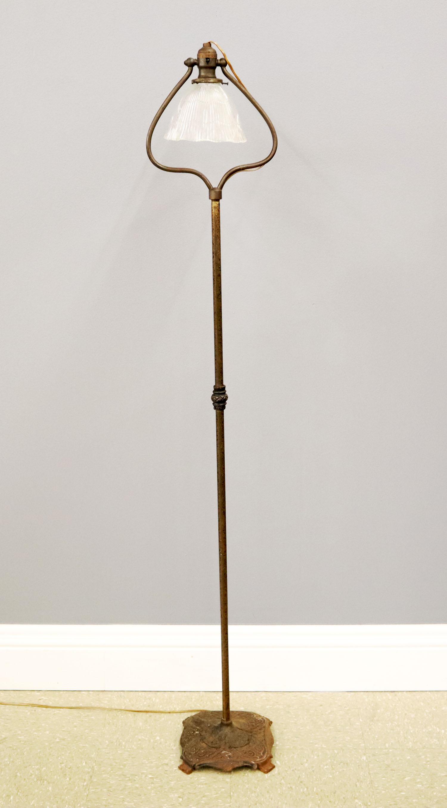 Iron Harp Floor Lamp: A 20th century iron harp floor lamp with pressed glass shade. Cast iron base with decorative casting. Rust and wear to base. 60" high. ESTIMATE $50-75.