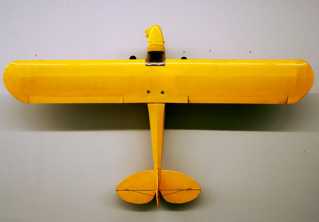 Piper Cub Tether Airplane Model: 1970s model Piper Cub tether airplane. Balsa wood frame, no motor. Overall surface dirt and some discoloration. 74" wide. ESTIMATE $100-200