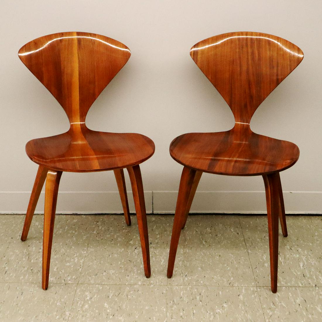 Pair of Cherner/Plycraft Side chairs: A Pair of mid-20th century side chairs by Norman Cherner for Plycraft. Bentwood style in walnut. Older refinishing with very minor wear. Each is 16 3/4 x 18 1/2 x 31" high. ESTIMATE $400-600
