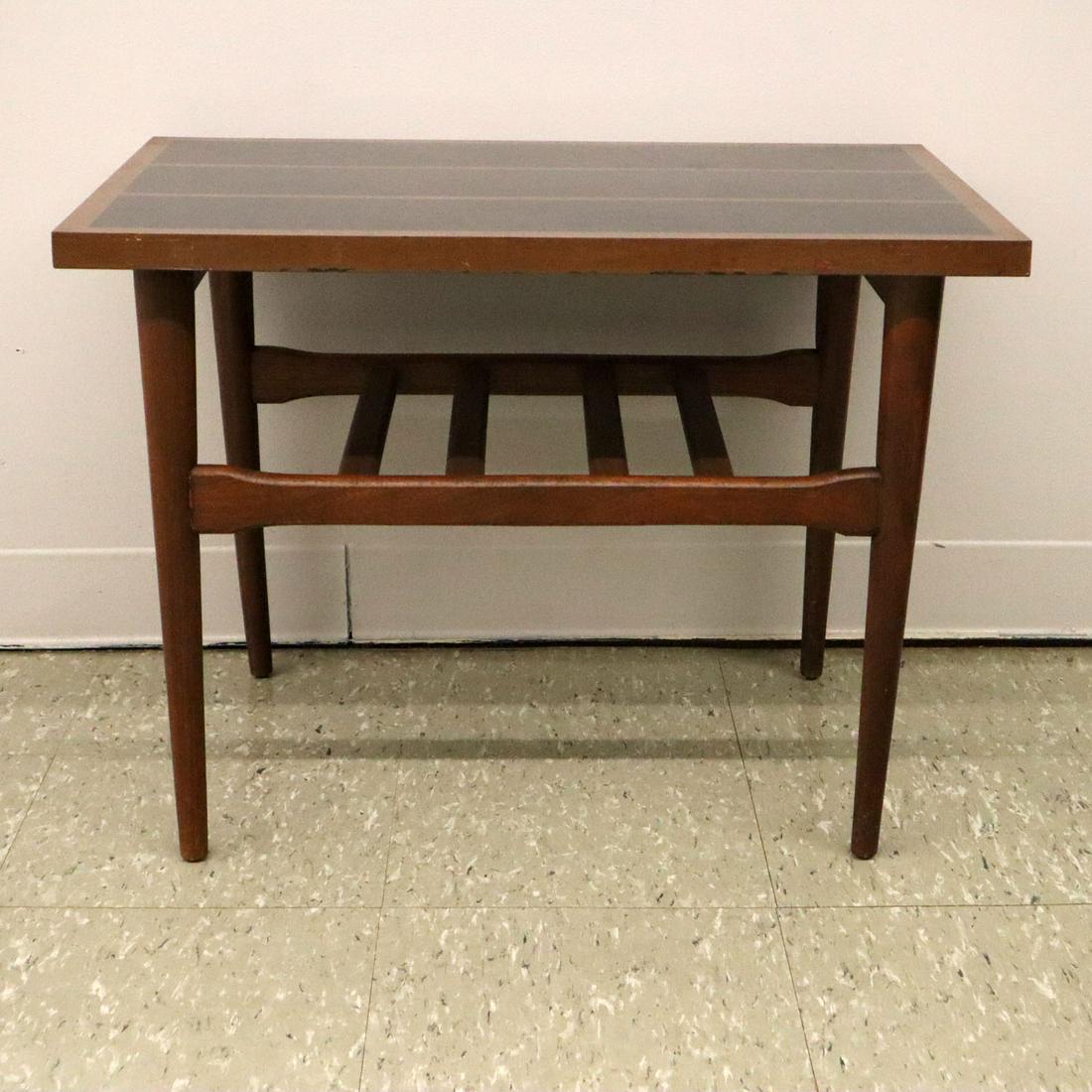 Teak Side Table: A mid-20th century teak side table. Geometric black and wood-grain Formica top on turned legs with a slat stretcher base. Minor wear to base, light scratches to top. 20 x 28 x 20 1/4" high. ESTIMATE $