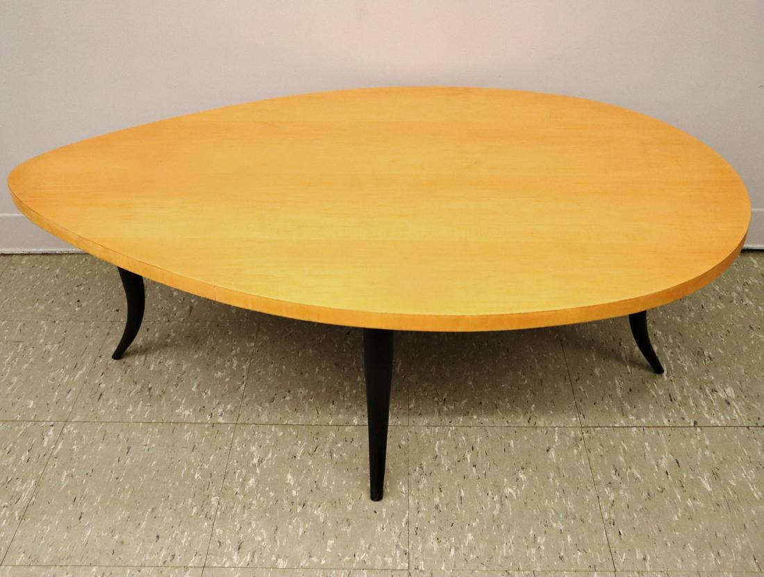 Midcentury Style Coffee Table: A late 20th century coffee table. Mid-Century style table comprised of an ebonized wood base and a natural finished maple elliptical top. Refinished, very minor wear. 31 x 48 x 16 1/2" high. ESTIMATE