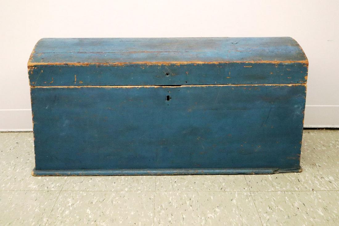 Painted Dome Blanket Box: An early 19th century dome blanket box. Original blue paint with canted sides. Wear to corners and minor losses to paint. Lock missing, replaced hinges, lacks side handles. 36 x 16 x 18 1/2" high. EST