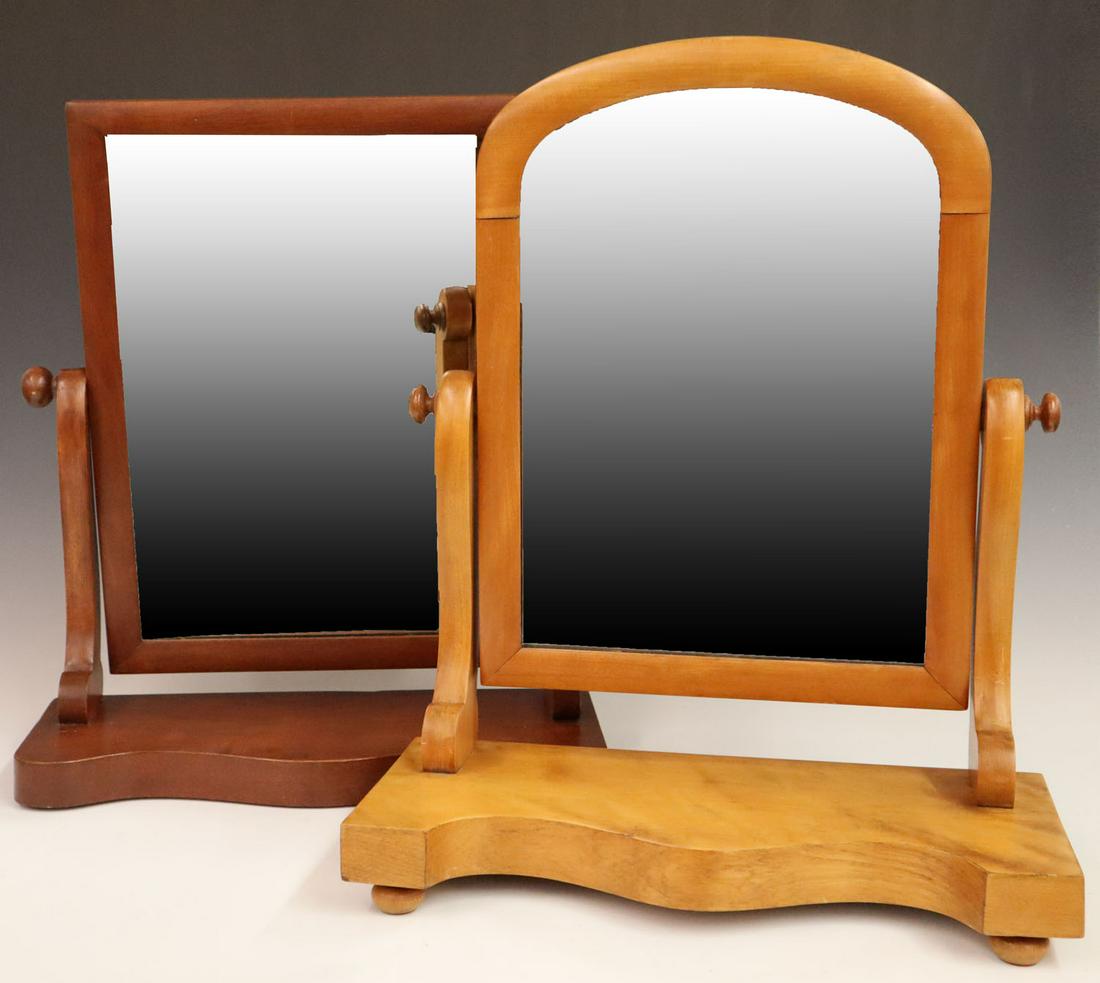 2 English Dressing Mirrors: Two mid-20th century English dressing mirrors. Including one mahogany and one flame birch. Both refinished with very minor wear at base corners. Up to 21" high. ESTIMATE $50-100