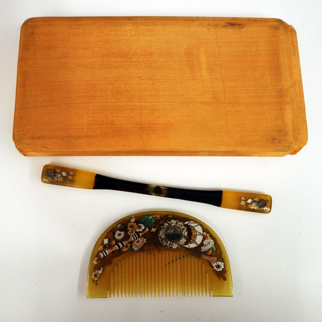 Kushi & Kougai: A Meiji Period Japanese Kushi & Kougai. Two piece lacquer and mother of pearl decorated comb and hair pin in a silk covered presentation box. Minor wear to decoration, two teeth slightly misshapen, bo
