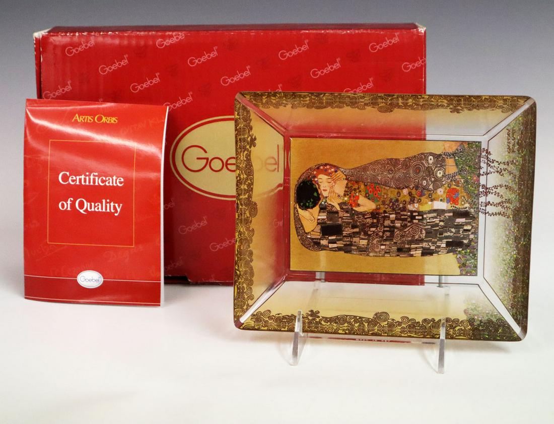 Artis Orbis/Klimt Tray: An Artis Orbis Gustav Klimt "The Kiss" Tray. Glass tray by Goebel in original box with paperwork and sticker. Issued June 28, 2008. Wear to box at corners. 7 1/2 x 6 1/4 deep. ESTIMATE $50-100