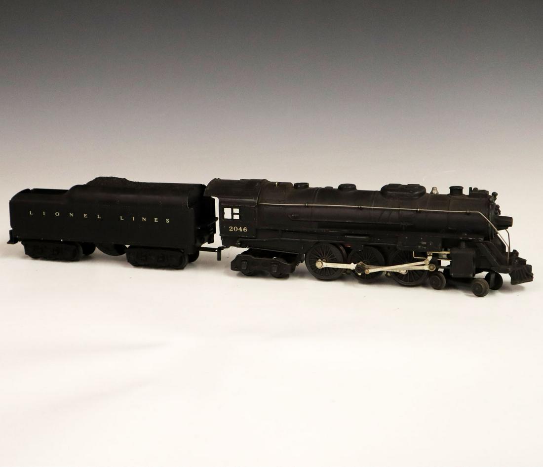 Lionel Locomotive & Tender: A Post-War O-Gauge Lionel Locomotive & Tender. Includes a 2046 locomotive and 2871 XX tender. Minor paint loss and light grime. 20 1/2" long. ESTIMATE $100-200