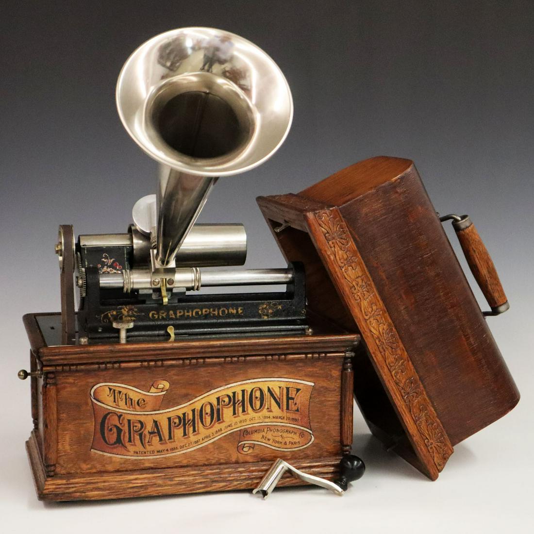 Columbia Graphophone Phonograph: A Turn of the Century Columbia Graphophone Phonograph. "Model AT" in an oak case with original "Banner" front decal and nickel plated horn. Serial #241019. Running when cataloged. Minor wear to case,