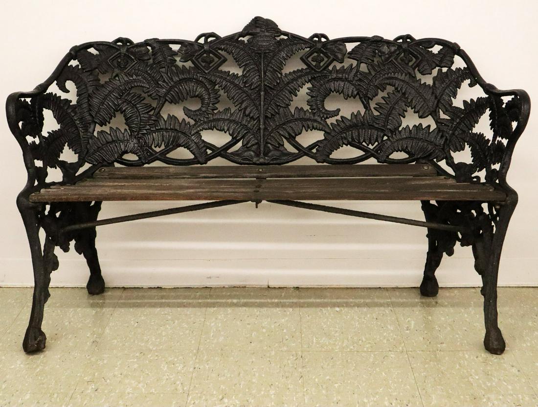 Cast Iron Garden Bench: A Mid-19th Century Cast Iron Garden Bench. Having a fern design with slat wood seat, by John Gray & Co., Glasgow. Older repaint, slats replaced. 59 x 23 x 36 1/2" high. ESTIMATE $400-600
