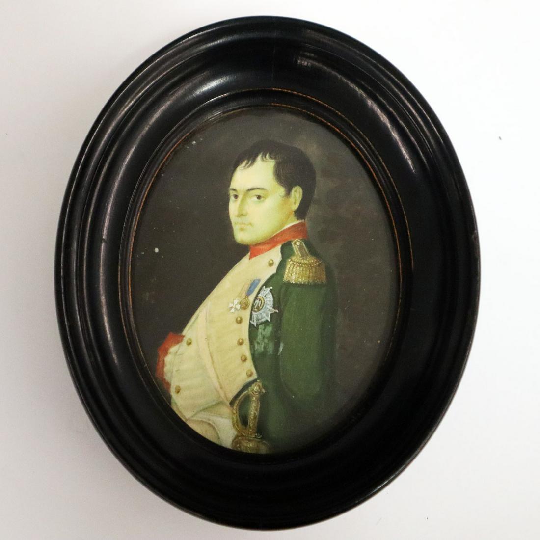 Watercolor of Napoleon: An Early 19th Century Watercolor Portrait of Napoleon. Oval portrait of Napoleon shown in a green uniform contained within an oval ebonized wood frame. Two small spots on background, possibly losses. 