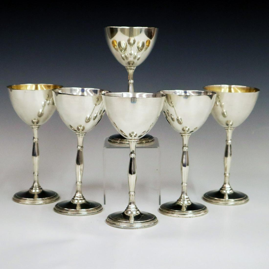 6 Grogan Sterling MidMod Wine Glasses: Six Grogan Co. Mid-Century Sterling Wine Glasses. Each having a shaped hexagonal stem and a round foot decorated with a beaded edge. Stamped with maker's mark and style number "4296" at the underside.
