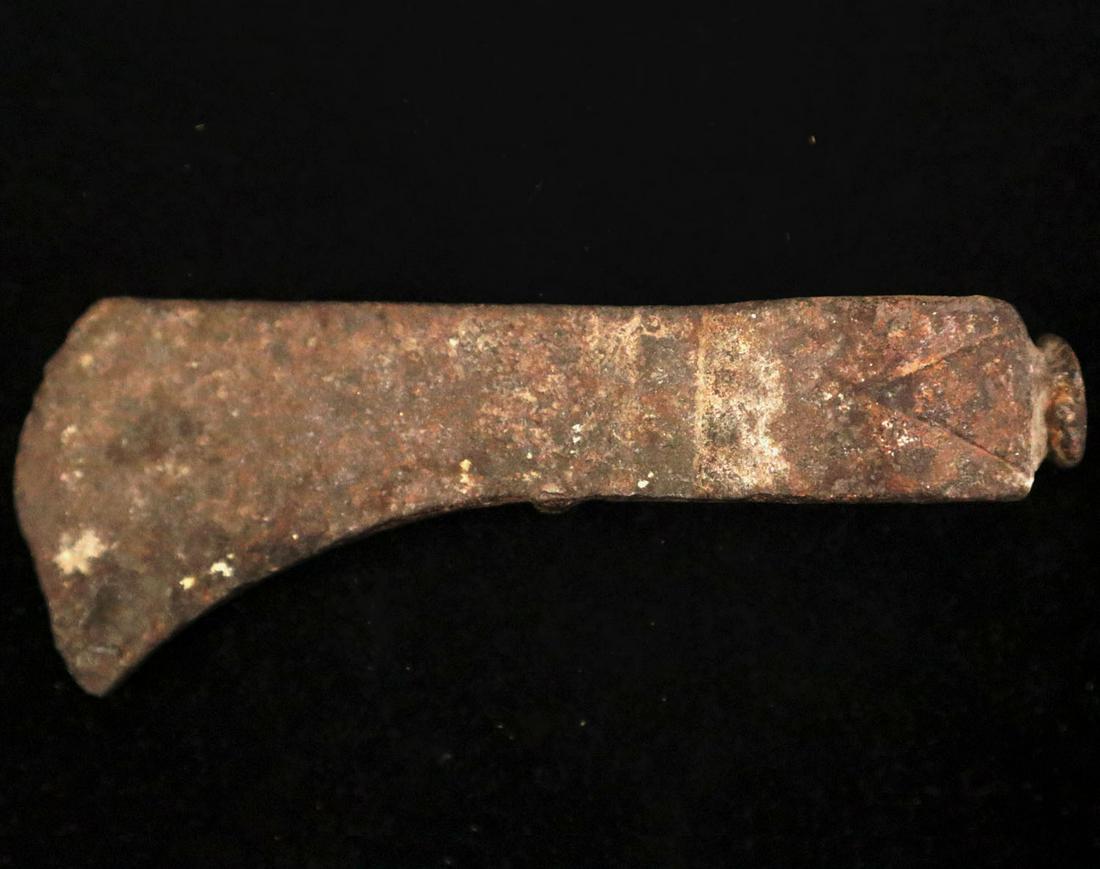 Iron Trade Axe: A Hand Forged Iron Trade Axe. With applied diamond decoration on the back and driving head and an unpolished patina. Chips to the edge, overall pitting, minor surface rust. 7 1/4" long. ESTIMATE $100-