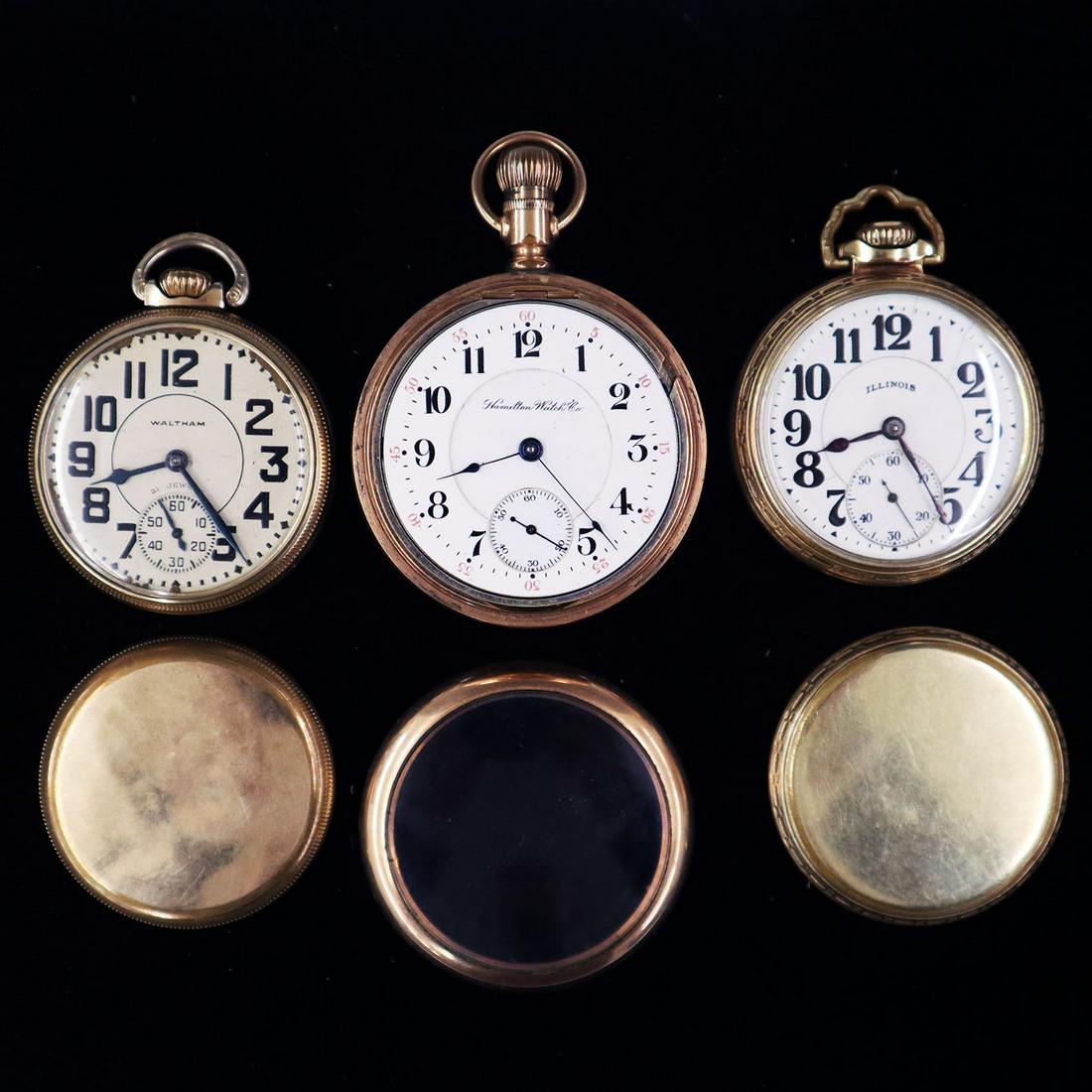 3 Railroad Type Watches: Three Gold Filled Railroad Type Watches. Including a Waltham 21 jewel lever set with Waltham screw back case, a Hamilton 17 jewel lever set in a C.W. & C. flip out case, and an Illinois 21 jewel lever