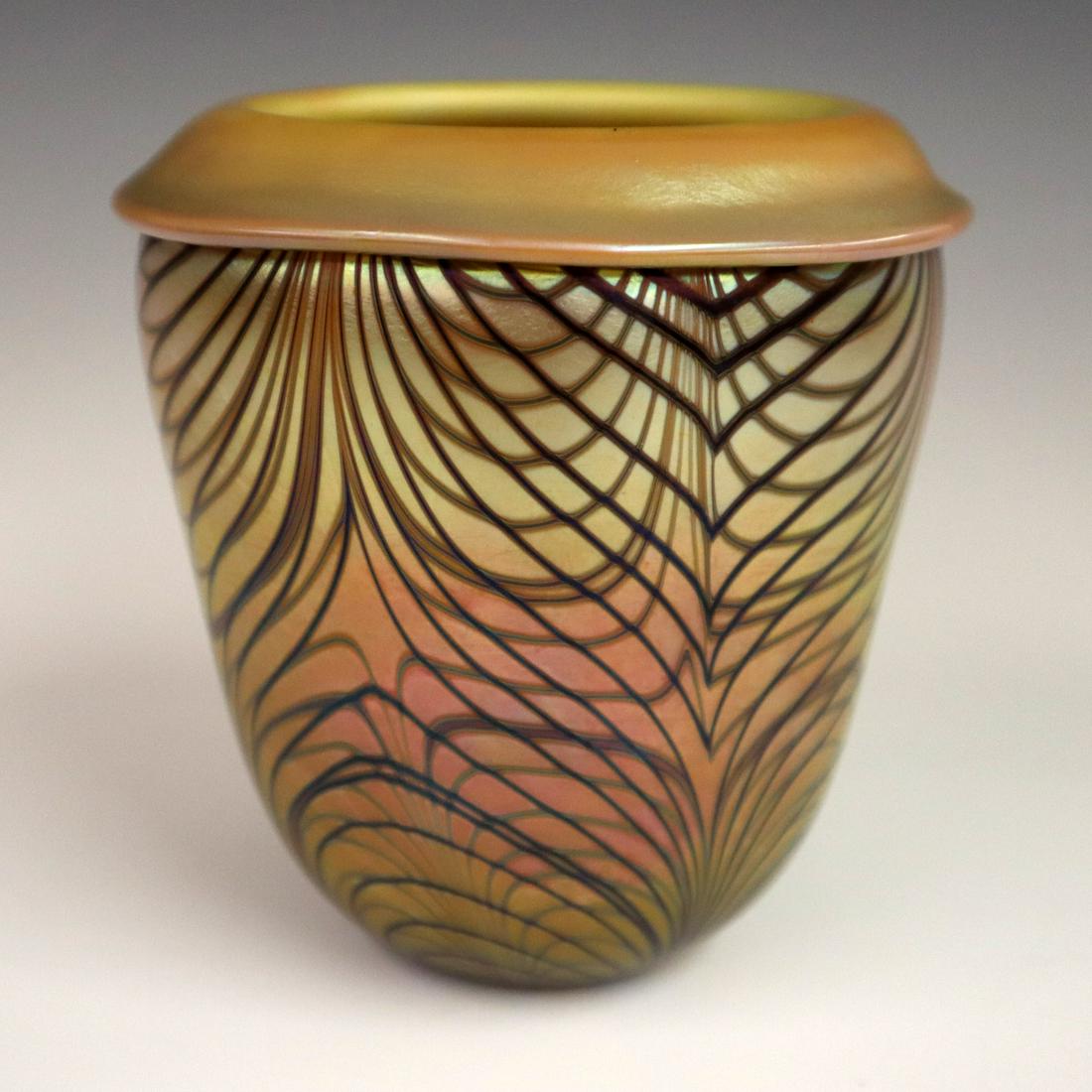 Orient & Flume Glass Vase: A Late 20th Century Orient & Flume Art Glass Vase. Having a rolled top rim and a lavender body with gold and blue "King Tut" design. Etched mark of "Orient & Flume 1976 J 23" at the underside along wi