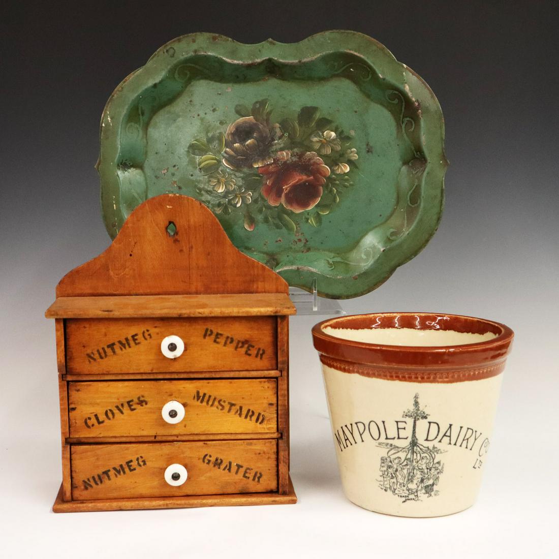 3 Kitchen Items: Three Early 20th Century Kitchen Items. Including a three drawer maple spice cabinet with stenciled drawers, a "Maypole Dairy" butter crock with handle, and a green tole serving tray with floral motif