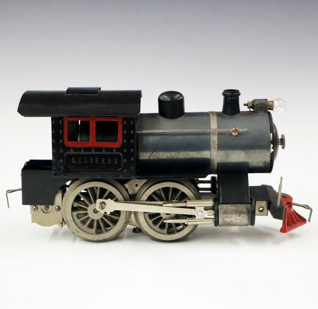 Pre-War Lionel Locomotive: A Pre-War Standard Gauge #5 Lionel Locomotive. Older restoration. Replaced wooden front bumper, missing one flag pole and minor wear to paint. 11 3/4" long x 3 3/4" wide x 5 3/4" high. ESTIMATE $400-6