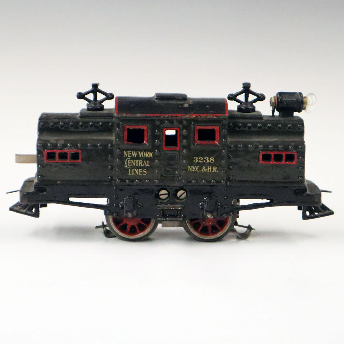 Pre-War Bing Locomotive: A Pre-War Bing O-Gauge 3283 Locomotive in cast iron. Thick original paint with some wear and losses, some surface rust to paint chips. 8 3/4" long x 2 1/2" wide, 4" high. ESTIMATE $100-200
