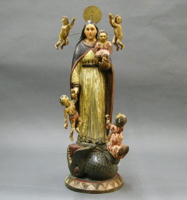 Santos: A 19th century Spanish colonial carved wooden Santos of Madonna and Children. Polychrome painted surface. Wear, flaking, older restoration and minor losses. 29" high.