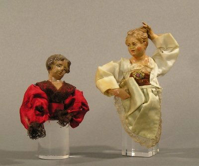 2 Crèche figures: Two 19th century Crèche figure busts. A woman with carved wooden head and another with earthenware head. Both with some damage, losses. On Lucite pedestals, up to 6" high.