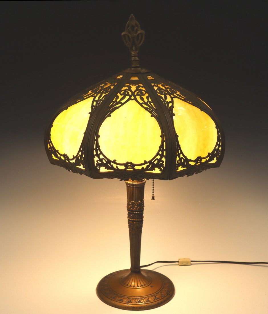 Miller Lamp Co. Slag Glass Lamp: A 1920's Miller Lamp Co. Slag Glass Lamp. Having a caramel slag glass panel shade and a cast iron base with fluted columnar and acanthus leaf motifs covered in a gold patina. Marked "ML Co". Wear to t