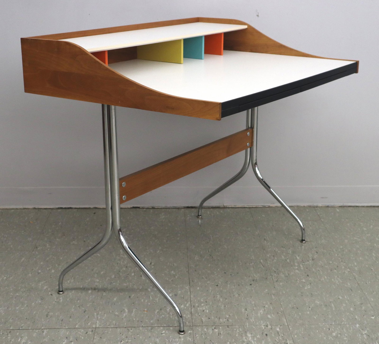 George Nelson for Herman Miller Swag Leg Desk: A George Nelson for Herman Miller "Swag Leg" Desk, c. 2010. Having a Cherry frame with white laminate top, painted dividers with two divided pull out drawers on a chrome base with Cherry stretcher. In