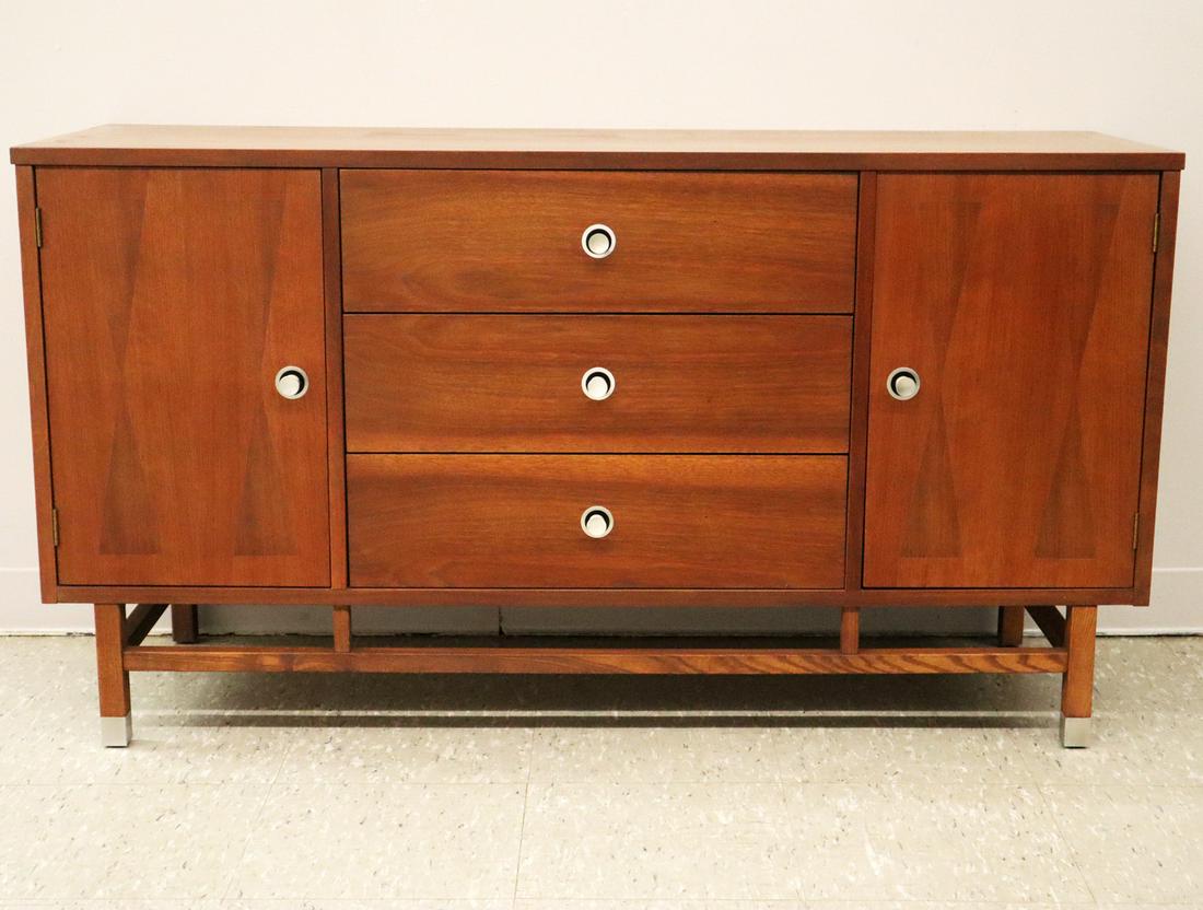 Stanley Credenza: A 1970's period Stanley Credenza. Walnut with Rosewood banding decorated with diamond pattern inlaid doors and original stainless steel hardware. Branded mark. Wear and fading to the original finish, 