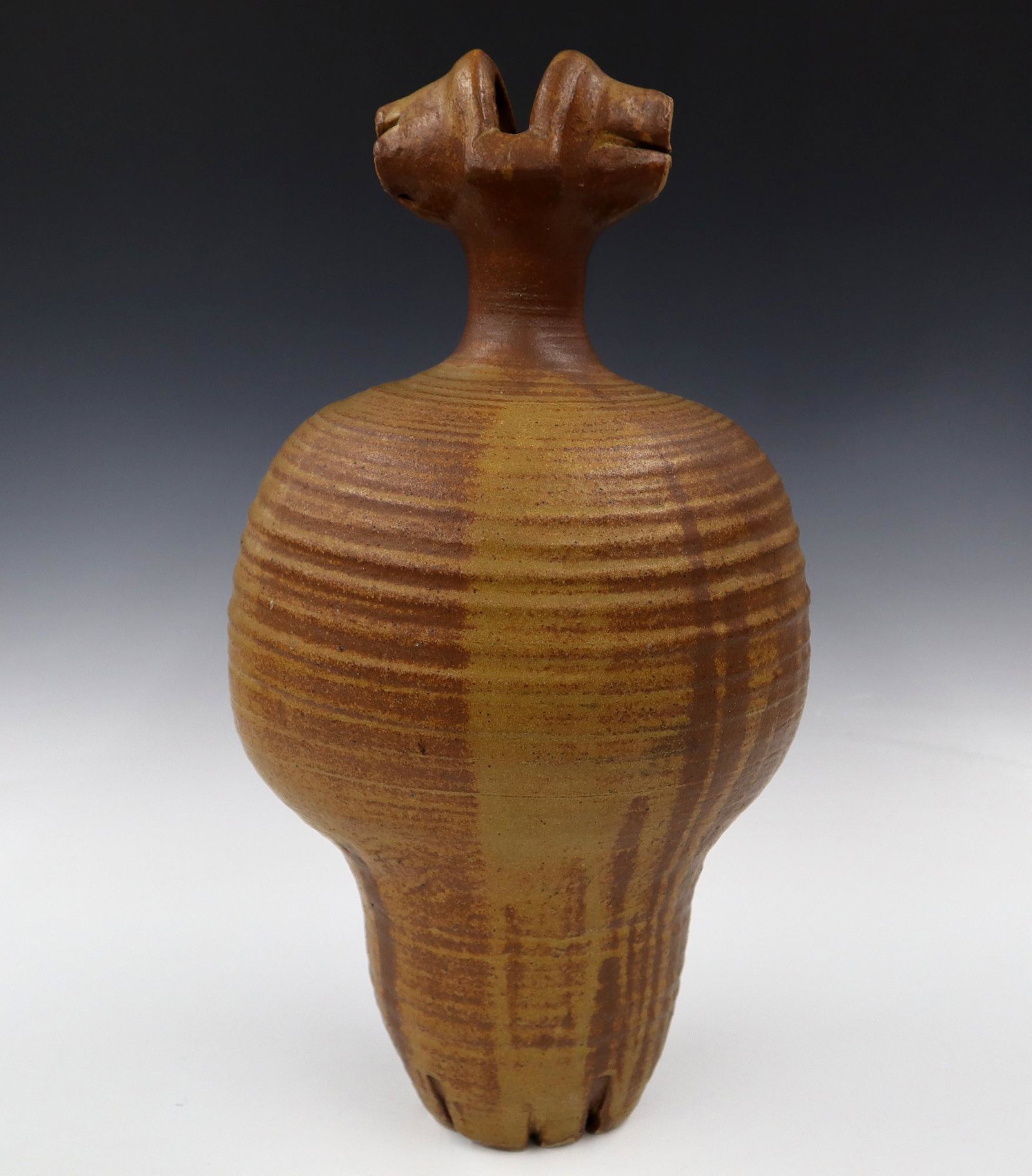 John Stephenson Stoneware Vessel: John Stephenson, American, 1929-2015. Stoneware "Tall Bottle" vessel in shades of brown with freehand decoration. Exhibited in the 2000 Ann Arbor Potters Guild Show "Firing Cycle" in the Historic Work