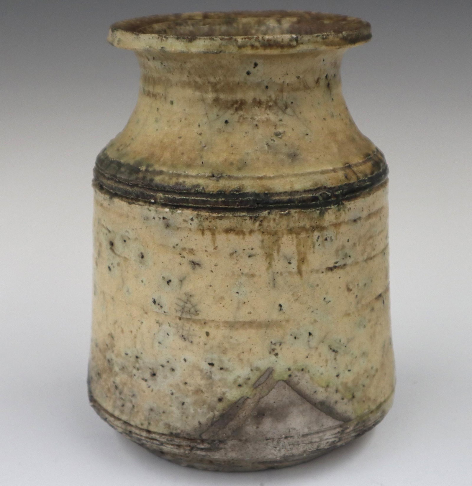 James H. Powell Raku Vase: James H. Powell, American, 20th century. Raku vase in ivory and grey with crackle glaze. Unsigned, c. 1960's. Crack in body, two small rim flakes. 5 1/2 x 7 1/2" high. ESTIMATE $50-100 Ex Collection: 