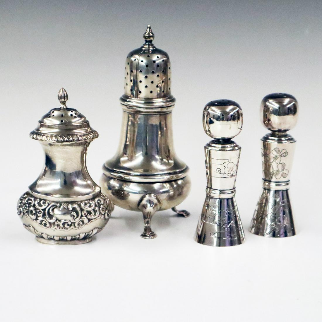 4 Silver Shakers: Four 20th century Silver Shakers. Including a pair of Asian .950 Silver Art Deco Salt and Pepper shakers, an English Sterling Pepper shaker, and an American Georgian style Pepper shaker. Minor wear, i