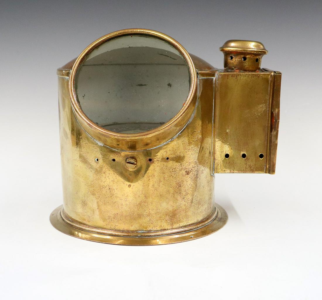 Ship's Binnacle: A Late 19th century Brass Cased Ship's Binnacle. By George Bodewes, Martenshoek (Netherlands) with original oil lamp, illumination compass functions. Some wear and minor indentations. 11 x 9 1/2 x 8 1
