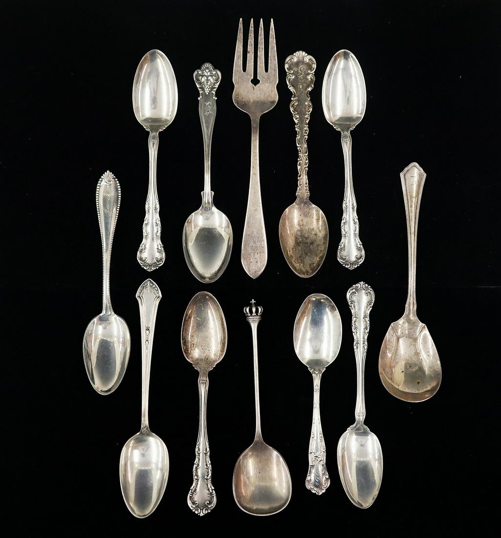 12 pcs of Sterling Silver Tableware: Twelve Pieces of early 20th century Sterling Silver Tableware. Including 11 spoons and 1 fork, dated 1900. 7.61 troy ozs. total. Some monogramed, minor wear. Up to 6 1/4" long. ESTIMATE $100-200
