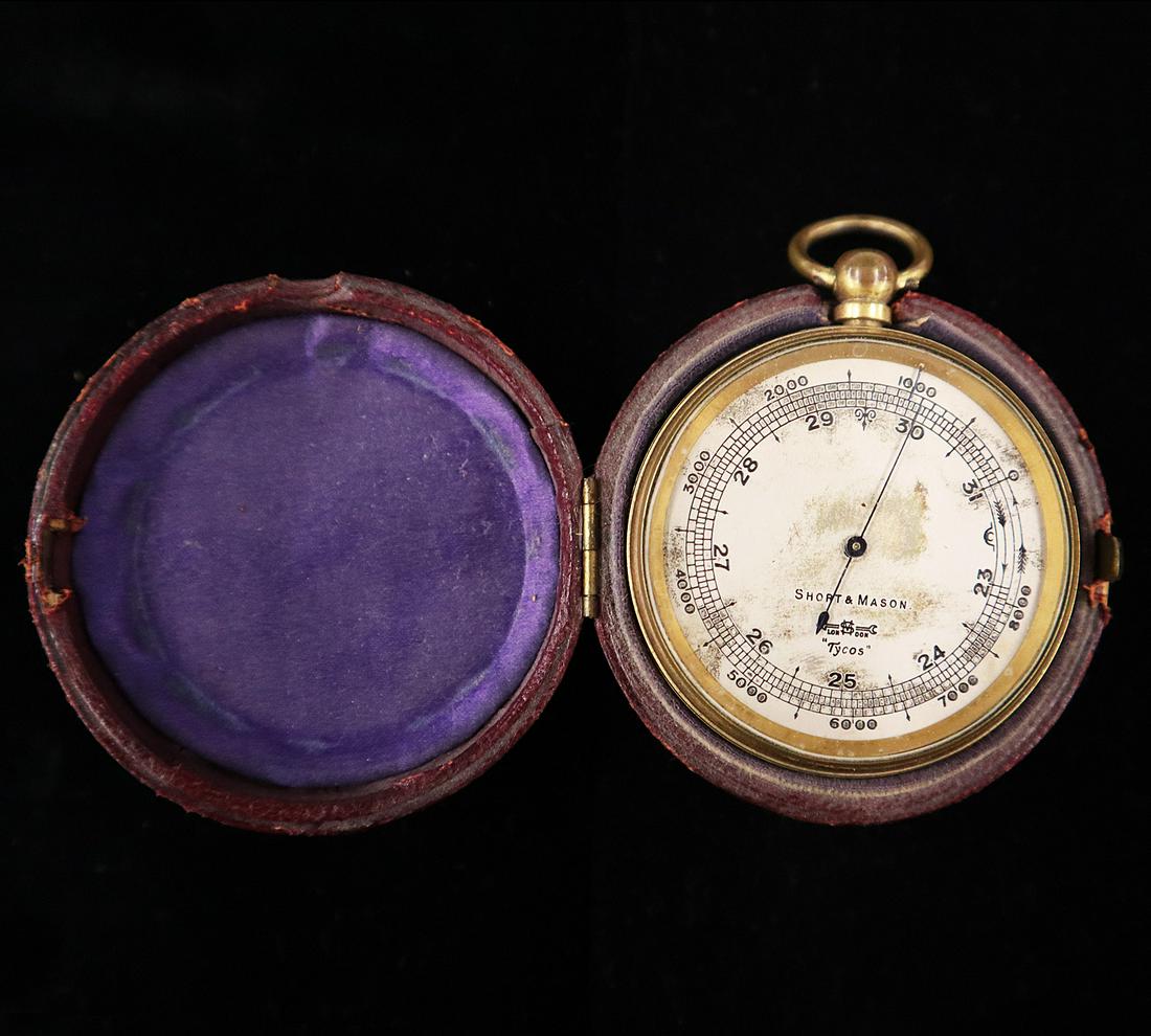 19th Century English Pocket Barometer: A 19th century English Pocket Barometer. "Tycos" model by Short & Mason, with silvered and engraved dial, is within a fitted leather case. Dial shows wear and tarnish, brass is worn, case shows wear a