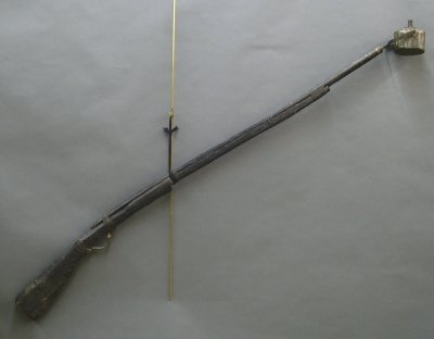 Lincoln/Hamlin Campaign Torch: A mid 19th century Lincoln/Hamlin musket form campaign torch from the 1860 campaign. Primitive carved wooden :musket" with metal fittings and a gimbaled tin torch with the names "LINCOLN" & "HAMLIN" p