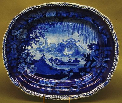 Blue Transfer Platter: An early 19th century Blue and White transferware platter. "Eastern Pagoda" pattern with Chinese Dignitaries in a Boat touring Hong Kong Harbor. Impressed marks "Wood" and "16" probably by Enoch Wood