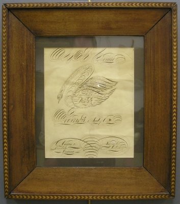 Caligraphy drawing: A late 19th century Canadian Spencerian calligraphy drawing. Depicts a Swan with the title "Purely Canadian Originally and Theoretically" above the phrase "Penmanship is the Soul of Commerce" and furt