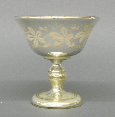 Etched Mercury Glass Compote: A late 19th century Mercury glass compote with etched "Birds in Branch" decoration with Gold interior. 1-part design with footed base. Slight wear. 6" high. ESTIMATE $100-200