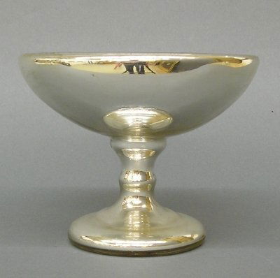 Mercury Glass Compote: A late 19th century Mercury glass compote. 1-part design with baluster stem and footed base. Slight wear. 6" high. ESTIMATE $100-200